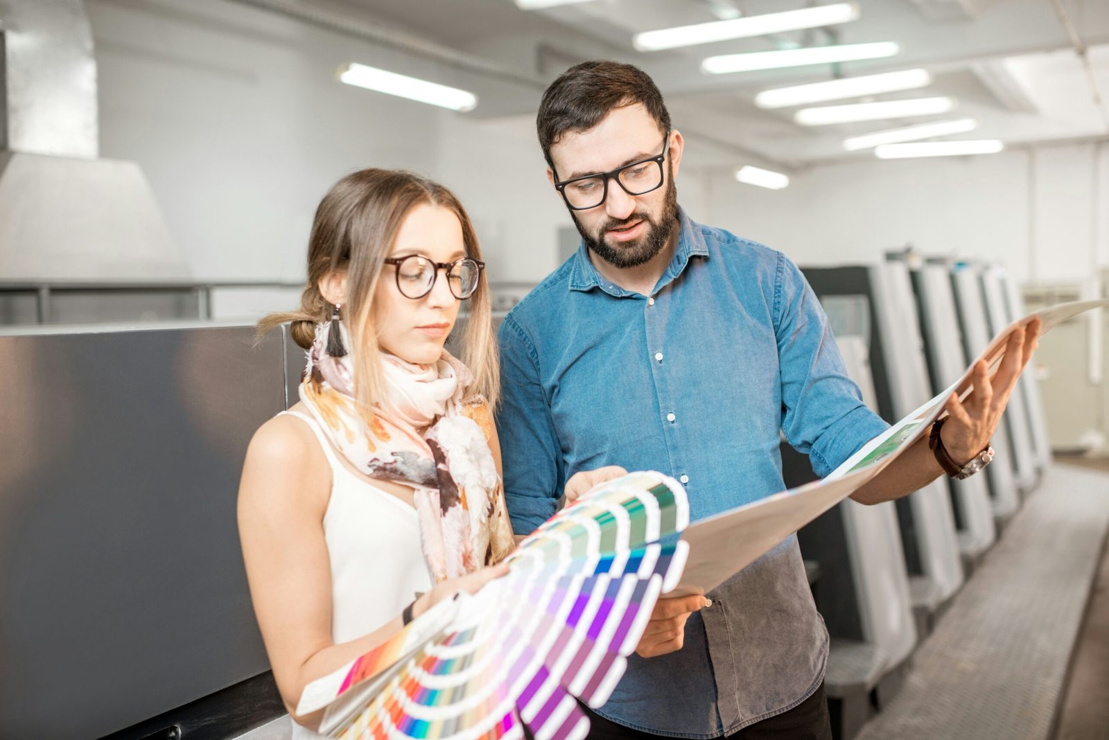 Man and woman looking at colours choosing between them showing working years