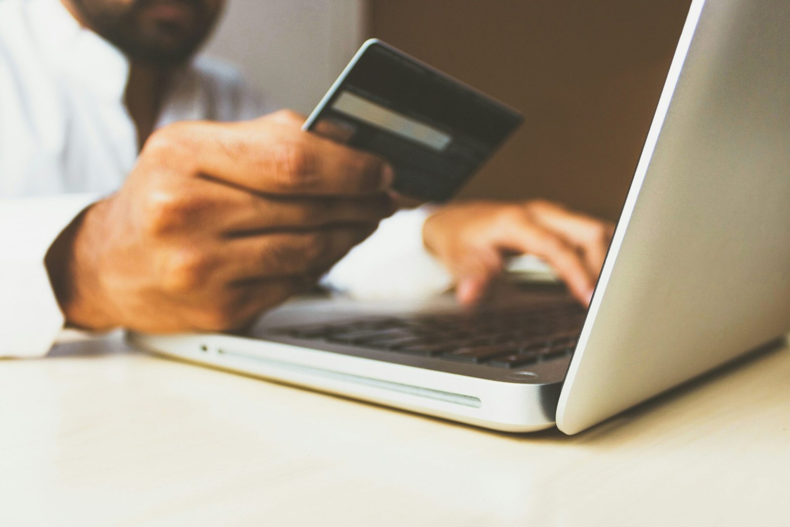 Man with a debit card looking to transfer his pension